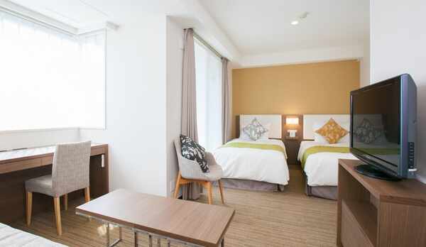 【客室】ツインB（広さ29㎡、ベッド幅103㎝&times;2台、洗濯乾燥機付き、電子レンジ、ミニキッチン付き）