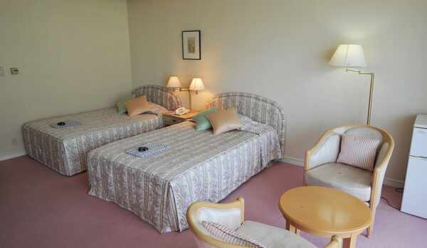 *ツインルーム一例。室内はやわらかな雰囲気の色調で統一しており、女性のお客様にもご好評です。