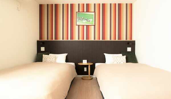 ツインルーム客室画像　ベッドは2台つなげることが可能です