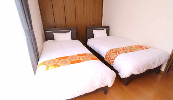 シングルベッドが2つの寝室