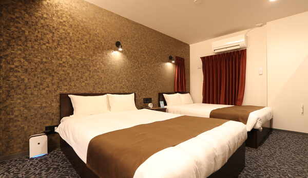 広々としたベッドルーム（ガーデンテラス付スイートツイン）